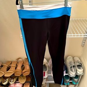 Women’s Lululemon long leggings, black and turquoise. Size 4. Moderately used.